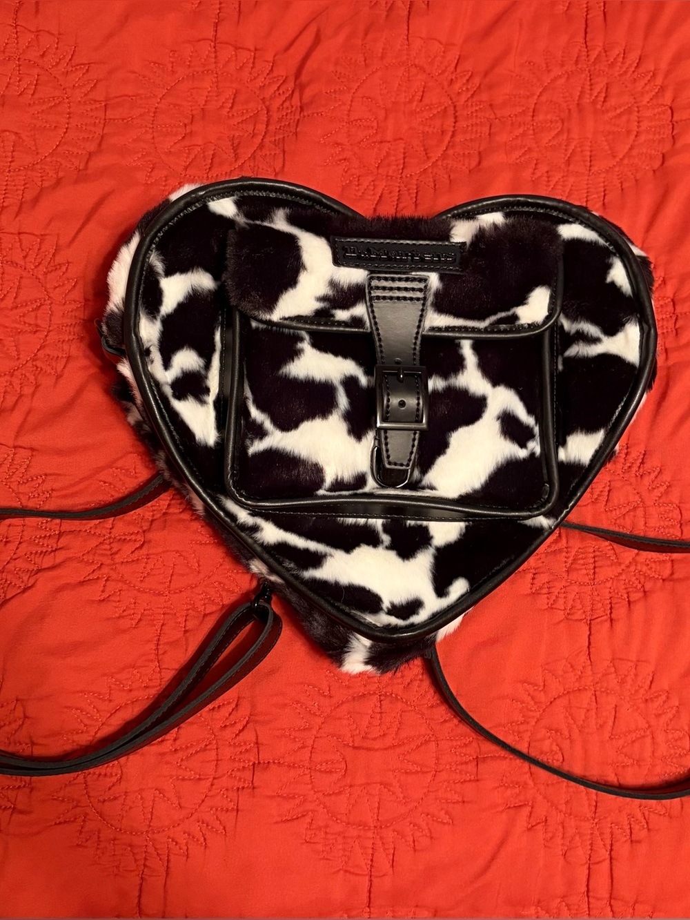 Dr. Martens heart shaped faux fur cow print backpack 🐄